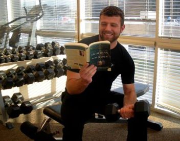 Hunky guy reads second book